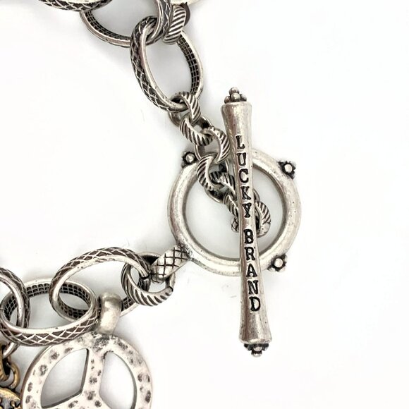 Lucky Brand peace sign and feathers trinkets toggle closure bracelet - Picture 3 of 3